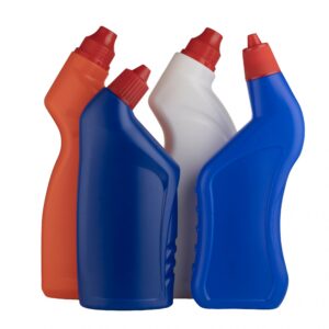 three colorful spray bottles with red caps on white background for cleaning products